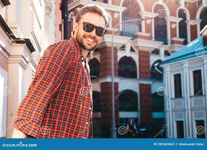 Sitting model handsome male guy floor stylish posing grey looking cool man fashion background casual rest